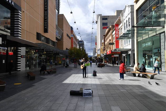 AUSTRALIA CORONAVIRUS COVID-19, A busker plays in a near empty Rundle Mall in Adelaide, Monday, April 6, 2020. The Australian Government has announced even tighter restrictions around social gatherings, and boosted stimulus spending, in attempts to fight off the coronavirus and it s affects on the economy. ( NO ARCHIVING, EDITORIAL USE ONLY, NO USE IN BOOKS WITHOUT CONSENT ADELAIDE SA AUSTRALIA  Copyright: xDAVIDxMARIUZx 20200406001461983035