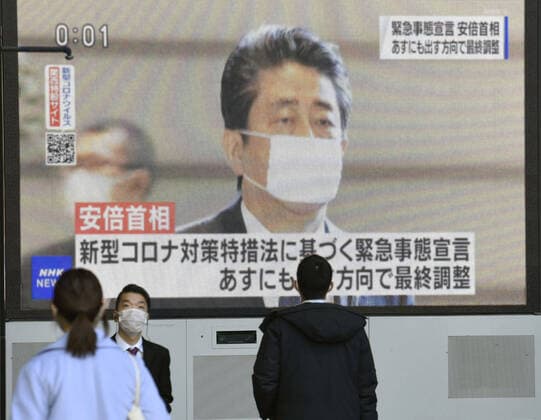 Japan to declare state of emergency amid surge in virus infections Photo taken April 6, 2020, shows a screen in Osaka displaying news that Prime Minister Shinzo Abe intends to declare a state of emergency in big cities such as Tokyo and Osaka following a recent surge in coronavirus infections. 