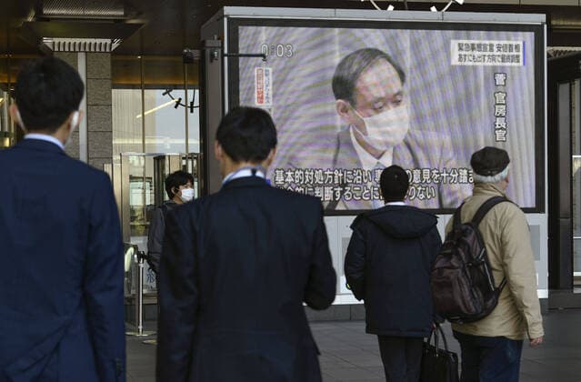 Japan to declare state of emergency amid surge in virus infections A screen photographed in Osaka on April 6, 2020, shows Japanese Chief Cabinet Secretary Yoshihide Suga speaking at a press conference amid the spread of the coronavirus. Prime Minister Shinzo Abe is expected to declare a state of emergency in big cities such as Tokyo and Osaka following a recent surge in coronavirus infections. 