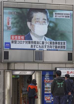 Japan to declare state of emergency amid surge in virus infections Photo taken April 6, 2020, shows a screen in Osaka displaying news that Prime Minister Shinzo Abe intends to declare a state of emergency in big cities such as Tokyo and Osaka following a recent surge in coronavirus infections. 