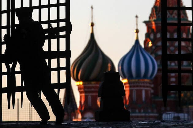 MOSCOW, RUSSIA - APRIL 6, 2020: A police officer at the Iberian Gate in a deserted Red Square during the pandemic of the novel coronavirus (COVID-19). As of 6 April 2020, Russia has reported more than 6,300 confirmed cases of the novel coronavirus, with more than 4,400 confirmed cases in Moscow. Since 30 March 2020, Moscow has been on lockdown in connection with the pandemic. The Russian government announced a paid period off work for employed people and school holidays, which is expected to last till the end of April. Valery Sharifulin TASS  TS0D4857