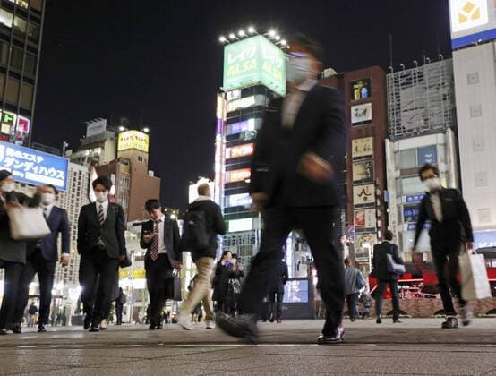 New coronavirus Masked people walk in Tokyo on April 6, 2020, amid concerns over the new coronavirus. 