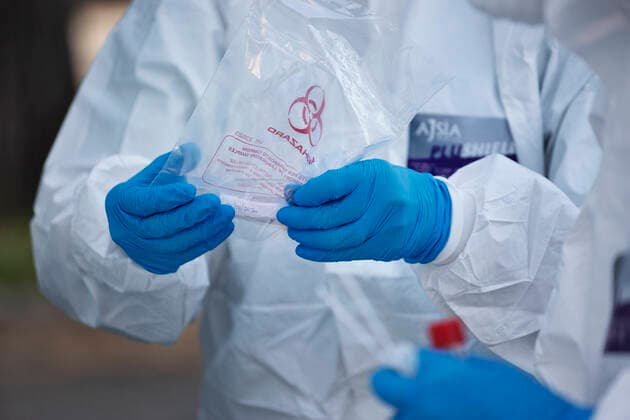 April 6, 2020, Roma, Roma, Italy: The collection of swab samples by medical staff in a drive-in testing center in Roma to check the Coronavirus (Covid-19).Health workers are dressing with protective suits..The Italian Government is still adopting the measure of a national lockout by closing all activities, except for essential services in an attempt to fight Coronavirus (COVID-19) .All the city, as all the whole country, is under quarantine and the movement are restricted to the necessary. Roma Italy - ZUMAt147 20200406_zip_t147_003 Copyright: xMatteoxTrevisanx