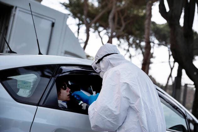 April 6, 2020, Roma, Roma, Italy: The collection of swab samples by medical staff in a drive-in testing center in Roma to check the Coronavirus (Covid-19).Health workers are dressing with protective suits..The Italian Government is still adopting the measure of a national lockout by closing all activities, except for essential services in an attempt to fight Coronavirus (COVID-19) .All the city, as all the whole country, is under quarantine and the movement are restricted to the necessary. Roma Italy - ZUMAt147 20200406_zip_t147_013 Copyright: xMatteoxTrevisanx