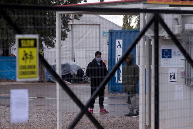 (200406) -- MALAKASA, April 6, 2020 -- Migrants are seen at the Malakasa camp near Athens, Greece, April 6, 2020. An Afghan migrant in Malakasa was confirmed to be infected with COVID-19 on Sunday, and the camp has been locked down since then. ) GREECE-MALAKASA-MIGRANTS-CAMP-COVID-19 MariosxLolos 