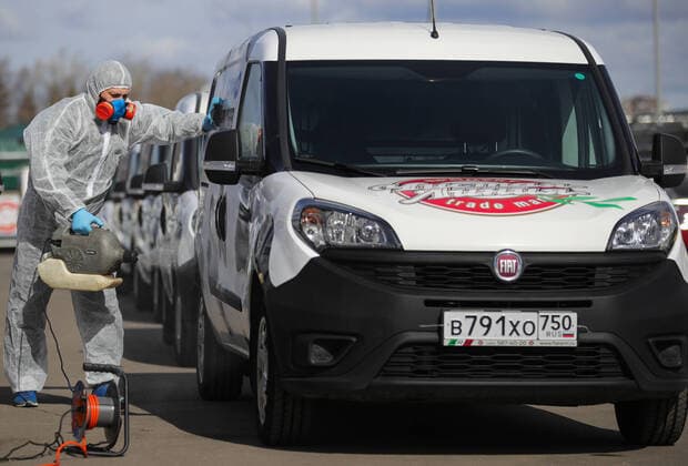 MOSCOW REGION, RUSSIA - APRIL 6, 2020: A worker sprays disinfectant on a delivery car outside the Chistaya Liniya Clean Line plant in the town of Dolgoprudny. Sergei Bobylev TASS  TS0D4941