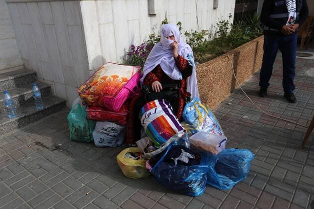 April 6, 2020, Khan Younis, Gaza Strip, Palestinian Territory: Palestinians who were quarantined leave the quarantine centers, after the end of the quarantine period in the center of Muscat in Khan Younis in the southern of Gaza strip, April 6, 2020 Khan Younis Palestinian Territory - ZUMAap3_ 20200406_zaf_ap3_101 Copyright: xAshrafxAmrax