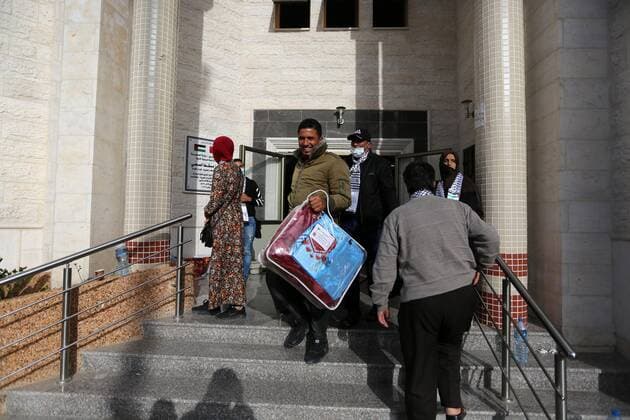 April 6, 2020, Khan Younis, Gaza Strip, Palestinian Territory: Palestinians who were quarantined leave the quarantine centers, after the end of the quarantine period in the center of Muscat in Khan Younis in the southern of Gaza strip, April 6, 2020 Khan Younis Palestinian Territory - ZUMAap3_ 20200406_zaf_ap3_109 Copyright: xAshrafxAmrax
