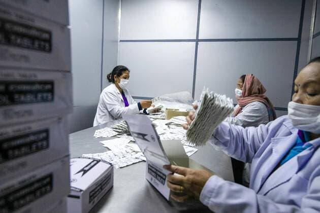 April 14, 2020, Kathmandu, Nepal: Workers label and arrange paracetamol Medicine at Nepal Ausadi Limited during the fourteenth day of the nationwide lockdown amid concerns about the spread of corona virus (COVID-19) in Kathmandu..The coronavirus outbreak has made the Indian government to restrict the export of dozens of drugs, including paracetamol leading to fears of a global shortage of essential medicines. Kathmandu Nepal - ZUMAs197 20200414_zaa_s197_002 Copyright: xPrabinxRanabhatx