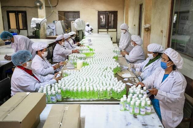 April 14, 2020, Kathmandu, Nepal: Workers label and arrange plastic bottles of hand sanitizer at Nepal Ausadi Limited during the fourteenth day of the nationwide lockdown amid concerns about the spread of corona virus (COVID-19) in Kathmandu..The coronavirus outbreak has made the Indian government to restrict the export of dozens of drugs, including paracetamol leading to fears of a global shortage of essential medicines. Kathmandu Nepal - ZUMAs197 20200414_zaa_s197_004 Copyright: xPrabinxRanabhatx