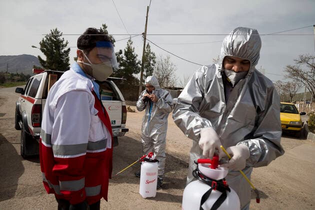 April 6, 2020, Tehran, Iran: Members of the Iranian Red Crescent s Volunteers Organization wearing face masks and protective suit attend the Hameh Sin (Torkaman) mountain village for sanitizing and screening villagers who may be infected by the novel coronavirus (COVID-19) disease in eastern Tehran, Iran. Media reported that Iran is one of the most affected by pandemic COVID-19 disease caused by the SARS-CoV-2 coronavirus. According to the latest reports by the Iranian Ministry of Health, over 3,700 people have died from the coronavirus infection throughout the country. Tehran Iran - ZUMAf146 20200406_zip_f146_021 Copyright: xRouzbehxFouladix