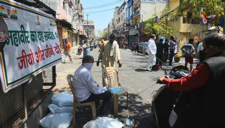 NEW DELHI, INDIA - APRIL 6: Food and water being distributed on the occasion of Mahavir Jayanti at Jain Sthanak Krishna Nagar, on day thirteen of the 21-day nationwide lockdown to check the spread of coronavirus on April 6, 2020 in New Delhi, India. (Photo by Sonu Mehta Hindustan Times) Government And NGOs Provide Food To Homeless And Poor Amid Lockdown To Prevent Covid-19