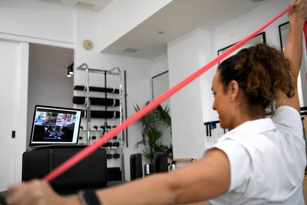 ONLINE PILATES CLASS COVID-19 FEATURE, Owner of Axis Physio & Pilates and professional physio, Tara Dighton teaches a virtual group pilates class in Sydney, Monday, April 6, 2020. Many fitness businesses around Australia are adapting to the COVID-19 lockdown rules by teaching virtual fitness classes and virtual one-on-one training sessions for their clients. ( NO ARCHIVING, EDITORIAL USE ONLY, NO USE IN BOOKS WITHOUT CONSENT SYDNEY NSW AUSTRALIA  Copyright: xBIANCAxDExMARCHIx 20200406001462092839