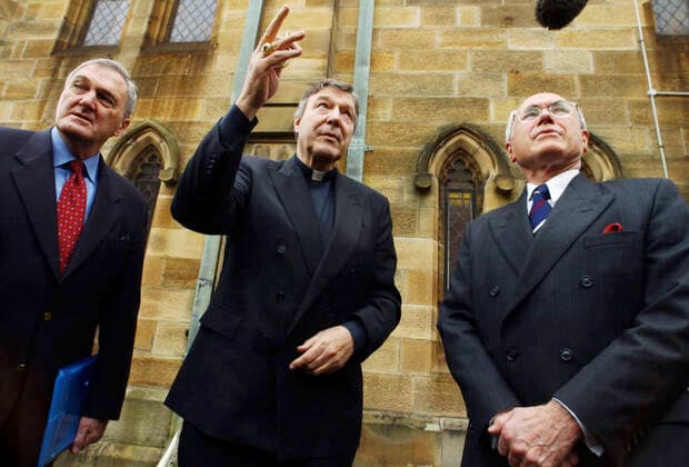 HOWARD CAMPUS SYDNEY, Sydney, August 1, 2004. Vice Chancellor of Notre Dame University Peter Tannock (l), Archbishop George Pell (c) and Prime Minister John Howard at St Benedicts Church, Broadway, prior to Mr. Howard s announcement of the federal government s decision to fund 200 private university places and deliver a $4 million cash injection to the University of Notre Dame when it opens its Sydney campuses over the next two years. ( NO ARCHIVING, EDITORIAL USE ONLY, NO USE IN BOOKS WITHOUT CONSENT SYDNEY NSW Australia  Copyright: xSAMxMOOYx 20040801000011381827