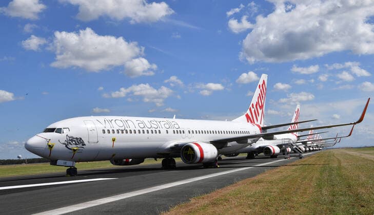 AUSTRALIA CORONAVIRUS COVID-19, Grounded Virgin Australia aircraft are seen parked at Brisbane Airport in Brisbane, Tuesday, April 7, 2020. Brisbane Airport Corporation (BAC) is working with airlines by accommodating up to 100 grounded aircraft free of charge in response to government-mandated travel restrictions that have grounded a significant proportion of Australia s airline fleet because of the Coronavirus (COVID-19). ( NO ARCHIVING, EDITORIAL USE ONLY, NO USE IN BOOKS WITHOUT CONSENT BRISBANE QLD AUSTRALIA  Copyright: xDARRENxENGLANDx 20200407001462126746