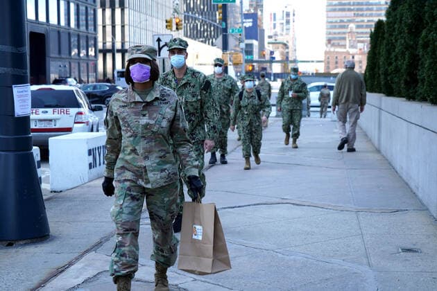 April 6, 2020, New York, New York, USA: Military and health care personnel at the Javits Center on the first day Covid patients are to be admitted to the converted convention center. The World Central Kitchen is providing free meals to all the workers donated by restaurants at Hudson Yards..The Jacob Javits Center,NYC.April 6, 2020.Photos by New York USA - ZUMAms4_ 20200406_zaf_ms4_009 Copyright: xSoniaxMoskowitzx