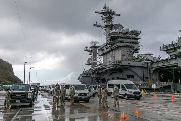 Seabees assigned to Naval Mobile Construction Battalion (NMCB) 1 and NMCB 5 coordinate transportation of Sailors assigned to the aircraft carrier USS Theodore Roosevelt (CVN 71) who have tested negative for COVID-19 and are asymptomatic from Naval Base Guam to Government of Guam and military-approved commercial lodging on April 3, 2020. Sailors will be required to remain in quarantine in their assigned lodging for at least 14 days, in accordance with DoD directive and the Governor s executive order. The vehicles departed the pier and picked up Theodore Roosevelt Sailors who had previously been isolated from the ship at locations on board Naval Base Guam.  WAX2020040603 MCxMATTHEWxR.xWHITE