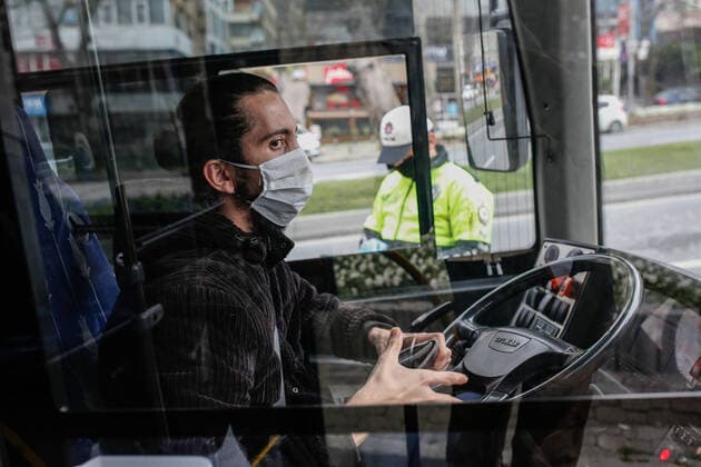 (200407) -- ISTANBUL, April 7, 2020 (Xinhua) -- A policeman checks a bus which people older than 65 are forbidden to take due to the spread of COVID-19 in Istanbul, Turkey, April 6, 2020. In Turkey, the second hardest-hit country in the Middle East, 3,148 new COVID-19 cases were reported on Monday, bringing the total number to 30,217, and the death toll surged to 649. (Xinhua) TURKEY-COVID-19 CASES 