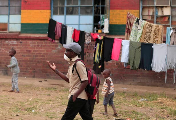 (200407) -- HARARE, April 7, 2020 (Xinhua) -- A man walks in a suburb in Harare, Zimbabwe, April 6, 2020. Zimbabwe is in a 21-day national lockdown which ends on April 19 in a bid to curb the spread of novel coronavirus. The country has so far recorded nine cases of COVID-19 and one death. (Photo by Shaun Jusa Xinhua) ZIMBABWE-HARARE-COVID-19-LOCKDOWN 