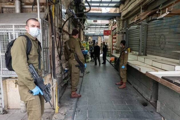 April 7, 2020, Jerusalem, Israel: IDF soldiers deployed to assist Israel Police in enforcing Coronavirus restrictions, patrol at the near empty iconic Shuk Mahane Yehuda Market in Jerusalem, as the Ministry of Defense shares responsibilities for managing the COVID-19 crisis. Jerusalem Israel - ZUMAa126 20200407_zap_a126_011 Copyright: xNirxAlonx