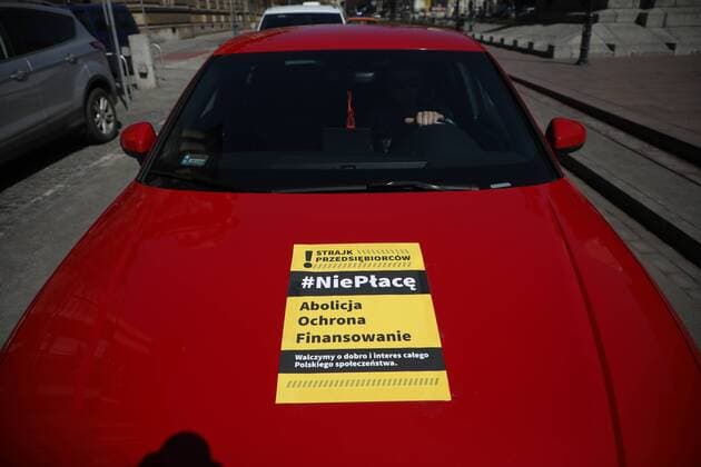 A car protest of the entrepreneurs in Krakow during the coronavirus outbreak A car protest of the entrepreneurs during the coronavirus outbreak on April 07, 2020 in Krakow, Poland. The card reads: Strike of the entrepreneurs. Iwon t pay. Abolition. Protection Bankrolling. we fight for the well-being and interests of the whole society EN_01423820_0011 