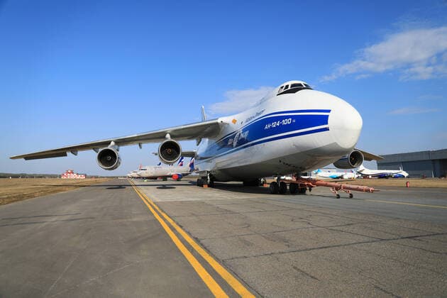 KRASNOYARSK TERRITORY, RUSSIA - APRIL 7, 2020: An Antonov An-124-100 Ruslan transport aircraft operated by the Volga-Dnepr cargo airline at Krasnoyarsk International Airport. Russia has halted all international flights since March 27, 2020, amid the ongoing COVID-19 coronavirus pandemic, except for repatriation flights. Since April 4, every repatriation flight has to be pre-arranged; Russian citizens arrive at Sheremetyevo Airport only, with the number of passengers per day limited to 500. The passenger traffic in Russian airports has decreased by 89% compared to April 2019. Andrei Samsonov TASS  TS0D4ABB