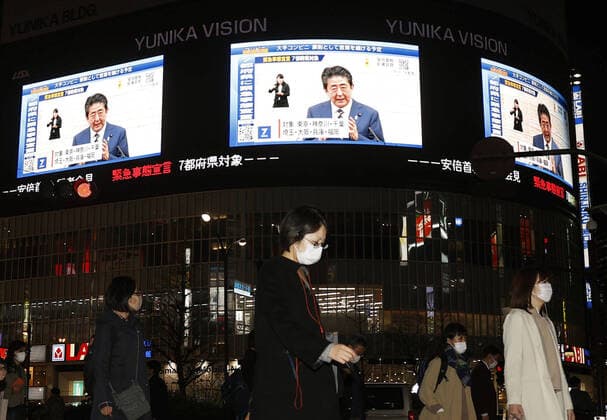 New coronavirus Large screens in Tokyo s Shinjuku area show Japanese Prime Minister Shinzo Abe speaking at a press conference in Tokyo on April 7, 2020, after declaring a state of emergency in the capital and other big cities in response to a surge in coronavirus infections. 