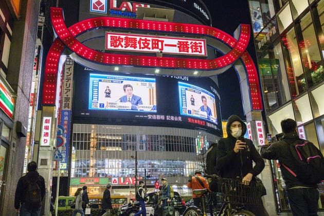 New coronavirus Large screens in Tokyo s Shinjuku area show Japanese Prime Minister Shinzo Abe speaking at a press conference in Tokyo on April 7, 2020, after declaring a state of emergency in the capital and other big cities in response to a surge in coronavirus infections. 