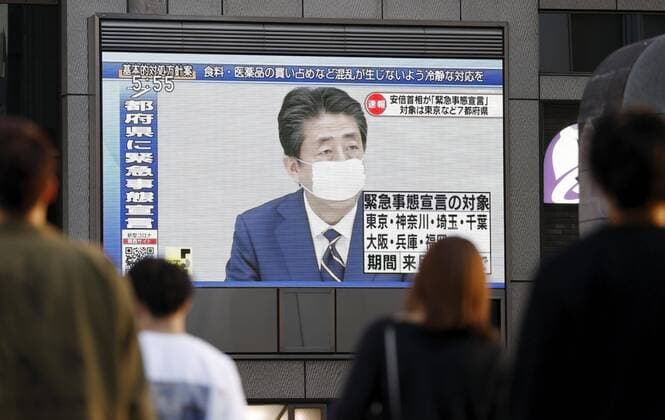 New coronavirus A large screen in Osaka s Dotonbori entertainment and commercial district shows Japanese Prime Minister Shinzo Abe speaking at a press conference in Tokyo on April 7, 2020, after declaring a state of emergency in the capital and other big cities in response to a surge in coronavirus infections. 