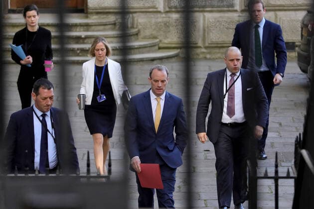 (200407) -- LONDON, April 7, 2020 (Xinhua) -- British Foreign Secretary Dominic Raab (C) arrives at 10 Downing street for the COVID-19 committee meeting in London, Britain, April 7, 2020. British Prime Minister Boris Johnson was taken to intensive care on Monday night after his coronavirus symptoms worsened, Downing Street said. Johnson has asked British Foreign Secretary Dominic Raab to deputize for him, a Downing Street spokesman said. (Photo by Tim Ireland Xinhua) BRITAIN-LONDON-COVID-19 