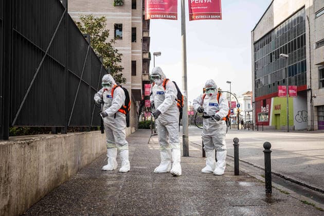 April 7, 2020, Girona, Spain: Civil protection agents dressed in protective suits spray disinfectants on the streets in front of a center for the elderly..During the Covid-19 crisis, the civil protection agents of Gerona carry out disinfection tasks in the residences for the elderly. Girona Spain - ZUMAs197 20200407_zaa_s197_042 Copyright: xMartixNavarrox