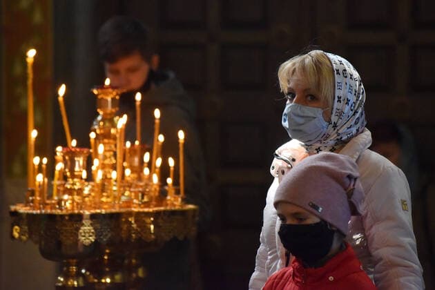 STAVROPOL TERRITORY, RUSSIA - APRIL 7, 2020: Russian Orthodox believers in face masks attend a service in the Cathedral of Christ the Saviour Healing An Infirm Man At The Pool of Bethesda, on the feast day of the Annunciation, in the city of Pyatigorsk, during the pandemic of the novel coronavirus (COVID-19). Anton Podgaiko TASS  TS0D4B13