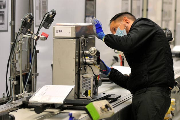 April 7, 2020, Martorell, Barcelona, Spain: A male assembly operator protected with a surgical mask and gloves during the manufacture of OxyGENs..Spanish automobile company, SEAT has shifted a team of 150 workers from manufacturing cars to making respirators that help COVID-19 patients, reusing mechanical parts like the windshield wiper motor. The respirator is called OxyGEN. Martorell Spain - ZUMAs197 20200407_zaa_s197_085 Copyright: xRamonxCostax