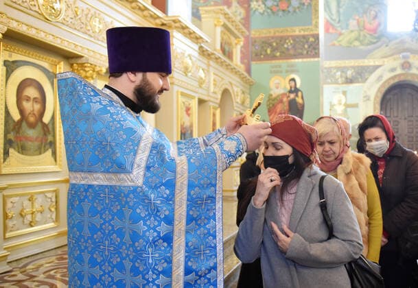 STAVROPOL TERRITORY, RUSSIA - APRIL 7, 2020: A Russian Orthodox priest holds a cross to bless believers after a service in the Cathedral of Christ the Saviour Healing An Infirm Man At The Pool of Bethesda, on the feast day of the Annunciation, in the city of Pyatigorsk, during the pandemic of the novel coronavirus (COVID-19). Anton Podgaiko TASS  TS0D4B87