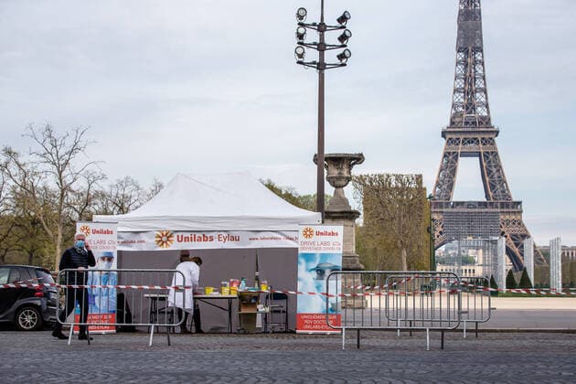 (200407) -- PARIS, April 7, 2020 (Xinhua) -- Biologists from Eylau Unilabs Analysis Laboratories work at a COVID-19 drive-through testing station near Champs de Mars in Paris, France, April 7, 2020. (Photo by Aurelien Morissard Xinhua) FRANCE-PARIS-COVID-19-DRIVE THROUGH TEST 