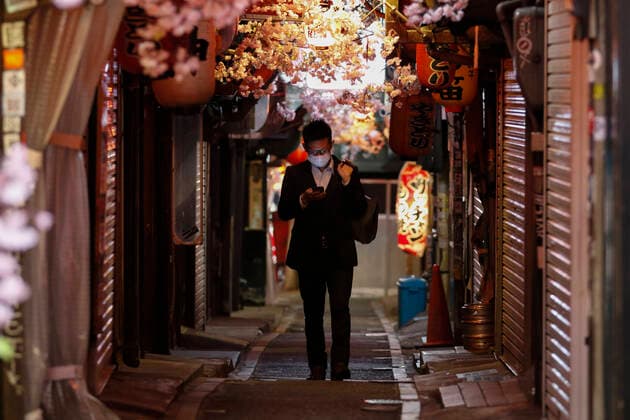 April 7, 2020, Tokyo, Japan: A Japanese salaryman wearing a face mask walks past between the closed izakaya bars of Omoide Yokocho in Shinjuku. Japanese Prime Minister Shinzo Abe declared a state of emergency for Tokyo and six other prefectures (Kanagawa, Saitama, Chiba, Osaka, Hyogo and Fukuoka) responding to the coronavirus pandemic. Tokyo Japan - ZUMAm191 20200407_zap_m191_024 Copyright: xRodrigoxReyesxMarinx