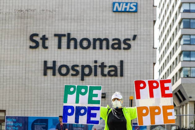 April 7, 2020, London, England, United Kingdom: A woman holding up signs (PPE-Personal Protection Equipment) stands outside St Thomas Hospital in central London as British Prime Minister Boris Johnson is in intensive care fighting the coronavirus in London, Tuesday, April 7, 2020. London United Kingdom - ZUMAx02_ 20200407_zaf_x02_010 Copyright: xVudixXhymshitix