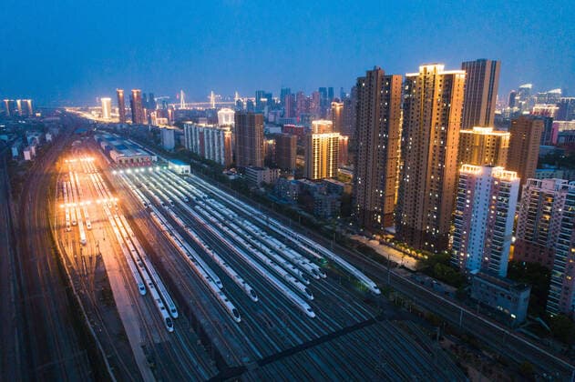 (200407) -- WUHAN, April 7, 2020 -- Aerial photo taken on April 7, 2020 shows bullet trains at a depot in Wuhan, central China s Hubei Province. Wuhan is expected to lift outbound travel restrictions from Wednesday after almost 11 weeks of lockdown. ) CHINA-HUBEI-WUHAN-TRAIN-DEPOT (CN) XiaoxYijiu 