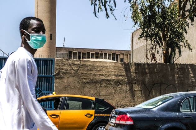 (200407) -- DAKAR, April 7, 2020 (Xinhua) -- A man wearing a face mask is seen on a street in Dakar, Senegal, on April 7, 2020. Senegalese Ministry of Health and Social Action said on Tuesday that 13 more patients have been cured of COVID-19, bringing the country s total number of patients cured to 105. Senegalese health minister Aboudulaye Diouf Sarr also said that the country s total confirmed cases stood at 237. Among the 237 confirmed cases, 85 are imported ones. (Photo by Eddy Peters Xinhua) SENEGAL-DAKAR-COVID-19-CASES 