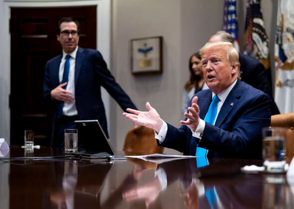 April 7, 2020, Washington, District of Columbia, USA: United States President Donald J. Trump makes remarks with United States Secretary of the Treasury Steven T. Mnuchin looking as he participates in a Small Business Relief Update, Tuesday, April 7, 2020. President Donald Trump announced in March that companies affected by the coronavirus will be given $50 billion more in low-interest loans federally guaranteed by the Small Business Administration Washington USA - ZUMAs152 20200407_zaa_s152_010 Copyright: xDougxMillsx