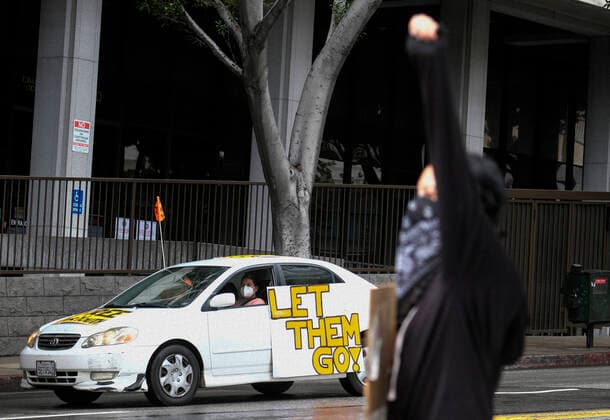 April 7, 2020, Los Angeles, California, U.S: Amid fears of the coronavirus pandemic, protesters drive their cars and trucks in a noisy procession in otherwise mostly silent, empty streets in downtown Los Angeles, Tuesday, April 7, 2020. The demonstration is designed to persuade county leaders to release the incarcerated from detention centers into homes where they can be monitored away from jails that have become breeding grounds for the virus. Los Angeles U.S. - ZUMAc68_ 20200407_zaf_c68_004 Copyright: xRingoxChiux