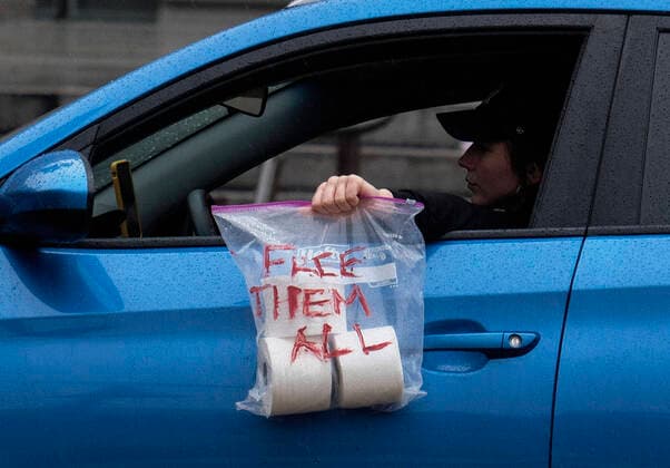 April 7, 2020, Los Angeles, California, U.S: Amid fears of the coronavirus pandemic, protesters drive their cars and trucks in a noisy procession in otherwise mostly silent, empty streets in downtown Los Angeles, Tuesday, April 7, 2020. The demonstration is designed to persuade county leaders to release the incarcerated from detention centers into homes where they can be monitored away from jails that have become breeding grounds for the virus. Los Angeles U.S. - ZUMAc68_ 20200407_zaf_c68_012 Copyright: xRingoxChiux