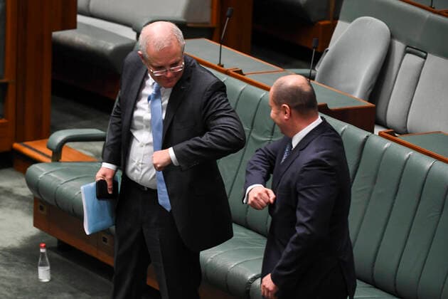 CORONAVIRUS LEGISLATION PARLIAMENT, Australian Prime Minister Scott Morrison (left) and Australian Federal Treasurer Josh Frydenberg elbow bump after the introduction of the Coronavirus Economic Response Package during a parliamentary sitting under rules of social distancing in the House of Representatives at Parliament House in Canberra, Wednesday, April 8, 2020. ( NO ARCHIVING, EDITORIAL USE ONLY, NO USE IN BOOKS WITHOUT CONSENT CANBERRA ACT AUSTRALIA  Copyright: xLUKASxCOCHx 20200408001462290971