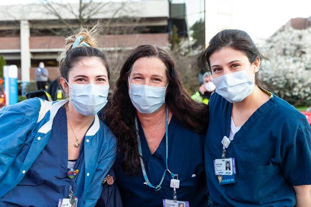 NY: Nassau County first responders salute medics Nurses pose during Nassau County first responders line up to salute heroes from front lines of COVID-19 pandemic at North Shore University Hospital Manhasset New York United States Copyright: LevxRadin