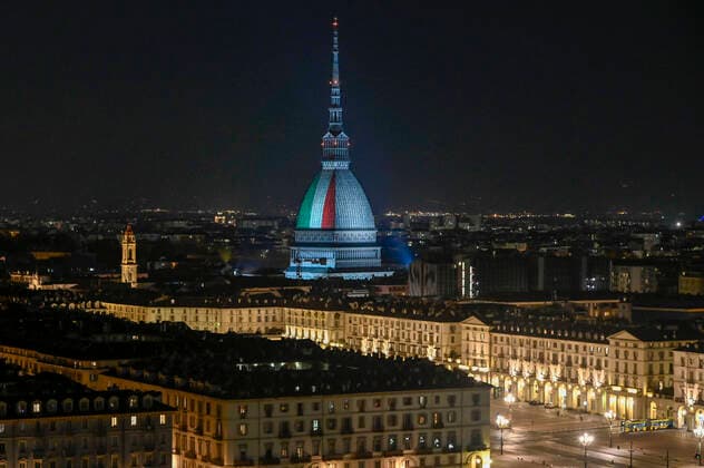 Turin. Intesa SanPaolo and Mole Antonelliana skyscraper with the Italian flag during the lockdown for Covid19 in the photo: Mole Antonelliana  Copyright: xRiccardoxGiordanox xIPAx xFotosickix