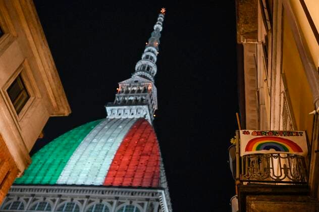 Turin. Intesa SanPaolo and Mole Antonelliana skyscraper with the Italian flag during the lockdown for Covid19 in the photo: Mole Antonelliana  Copyright: xRiccardoxGiordanox xIPAx xFotosickix