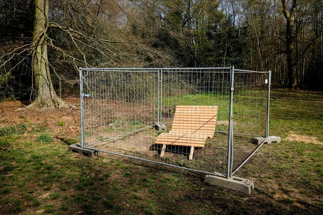 07 04 2020, Duisburg, Ruhr Area, North Rhine-Westphalia, Germany Park bench in Duisburgs municipal forest in times of the corona crisis, fenced off by a construction fence, with contact ban Duisburg North Rhine-Westphalia Germany