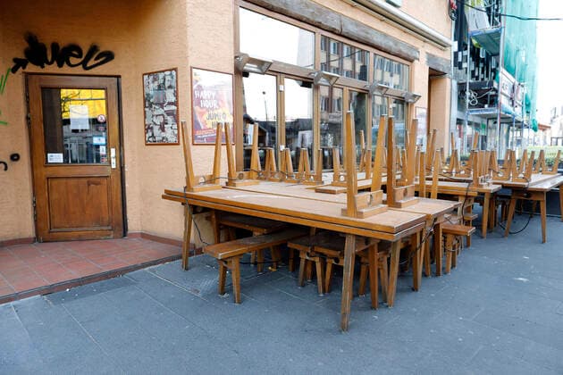 08 04 2020 Bochum city centre city around the Bermuda Triangle Everything is empty chairs put up all pubs closed because of Corona Virus sign with Happy Hour