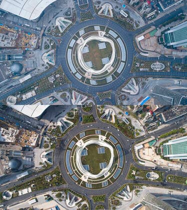 (200408) -- WUHAN, April 8, 2020 -- Aerial combo photo shows the Optics Valley Square in Wuhan, central China s Hubei Province on Jan. 26, 2020 (upper) and on April 8, 2020. With long lines of cars streaming through expressway tollgates and masked passengers boarding trains, the megacity of Wuhan in central China lifted outbound travel restrictions on Wednesday after almost 11 weeks of lockdown imposed to stem the COVID-19 outbreak ) CHINA-HUBEI-WUHAN-LIFE-RESUMING (CN) XiongxQi 