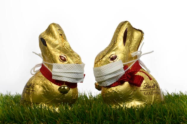 Symbol picture Easter during the Corona crisis, two chocolate Easter bunnies with mouthguards, Stuttgart, Baden Württemberg, Germany Refrigerator filled to bursting point